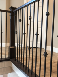 Painted Post with Black Stained Hand Railing and Black Iron Balusters with Flat Shoes