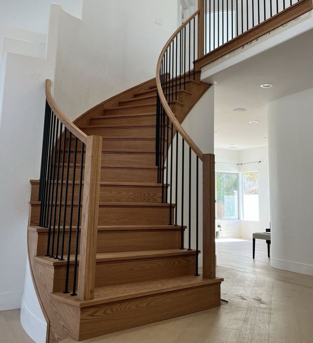 Modern Style Curved Staircase Design with Square White Oak Wooden Posts and Square Handrailing with Vertical Square Black Iron Balusters