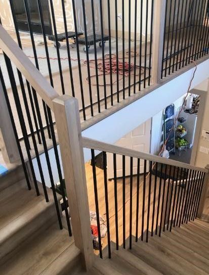 Round Black Balusters with White Oak Newel Posts and Railing