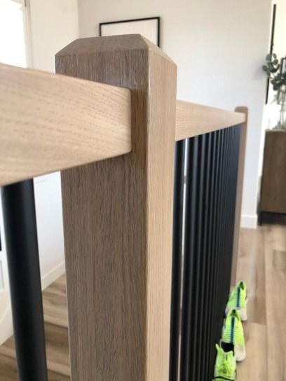 White Oak Chamfered Top Newel Post and White Oak Square Hand Railing with Vertical Black Round Balusters