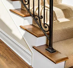 Stained Tread Ends With Iron Railing