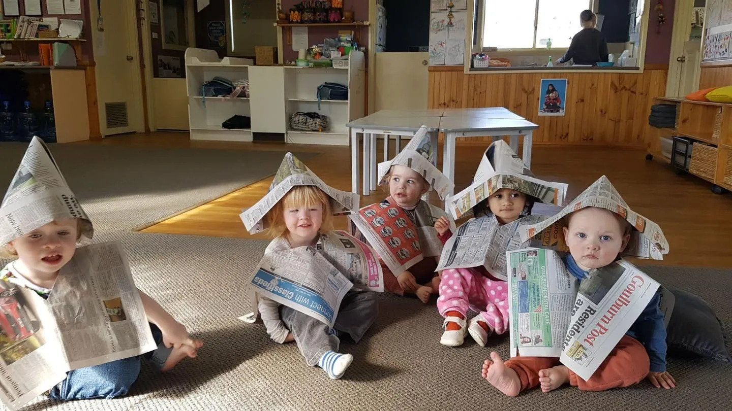 Toddlers Wearing Newspaper Costume — Goulburn, NSW — River Heights Child Care Centre