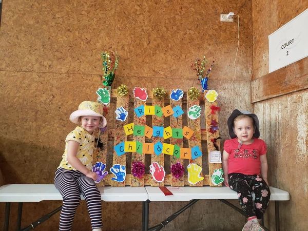 Two Girls Wearing a Hat — Goulburn, NSW — River Heights Child Care Centre