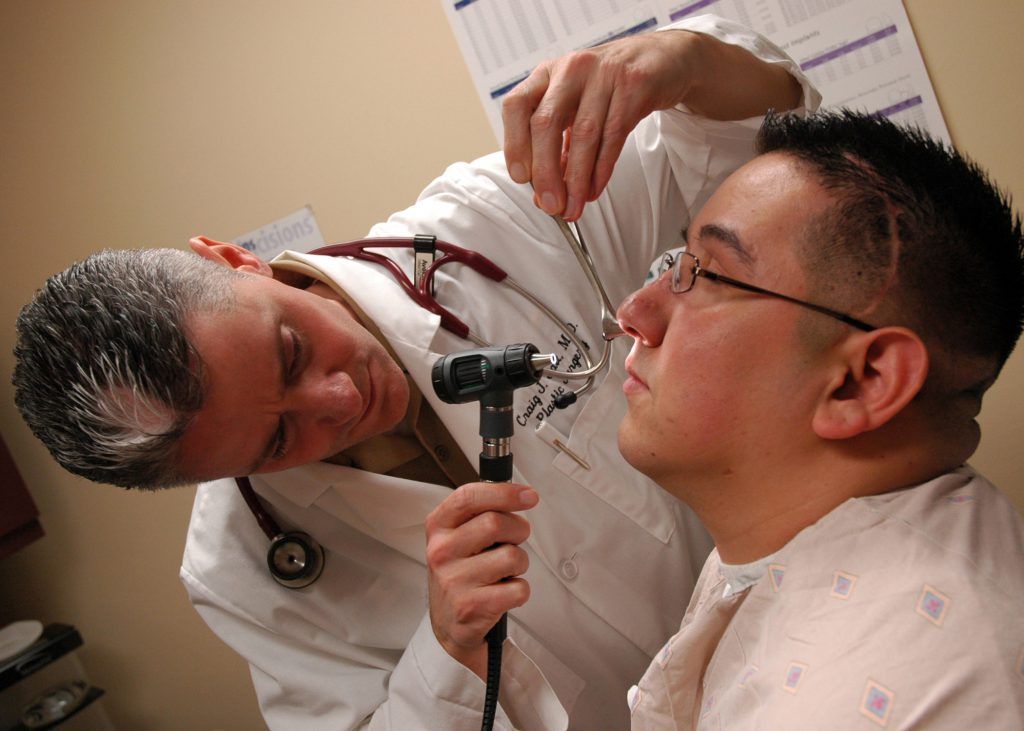Doctor Checking the Nose — Roseville, CA — Frank Penney Injury Lawyers
