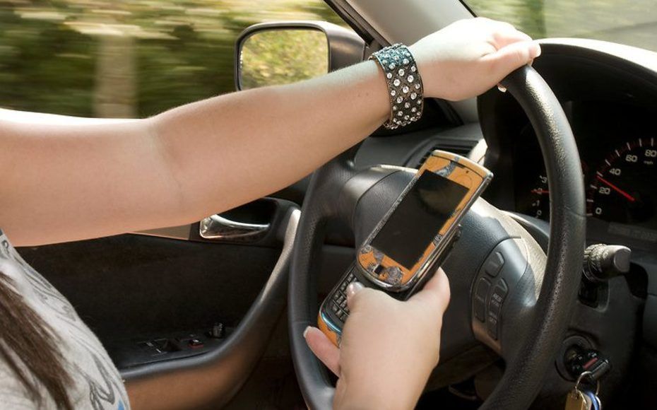 Woman Texting While Driving — Roseville, CA — Frank Penney Injury Lawyers