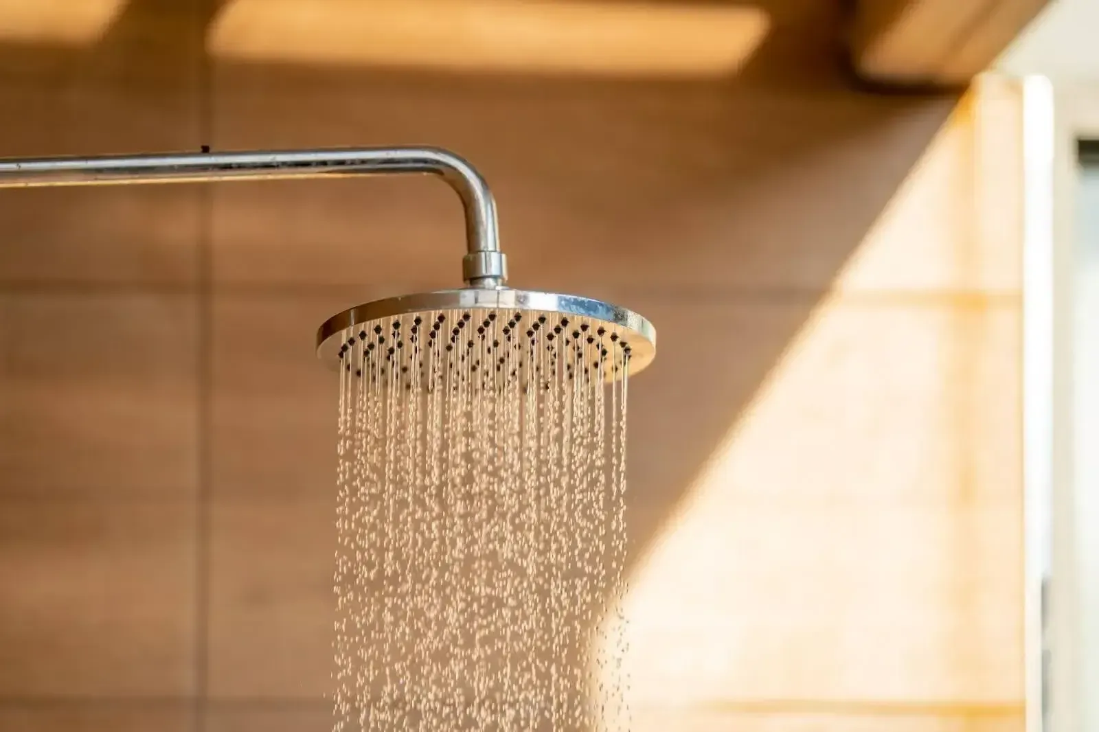 a rainfall showerhead spraying water