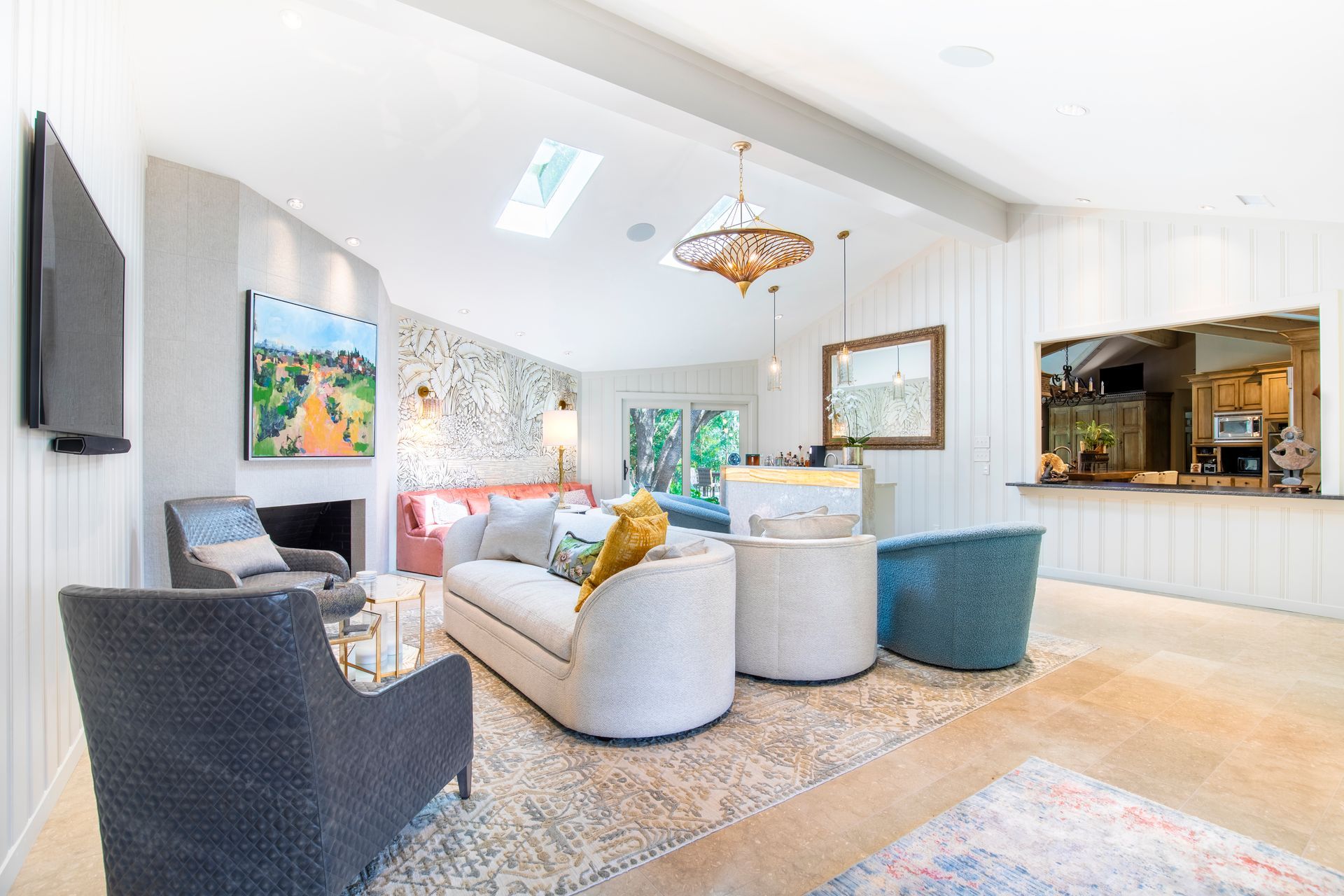 Living room with white walls, skylight, light-colored furniture. Northwood Hills living room renovation.
