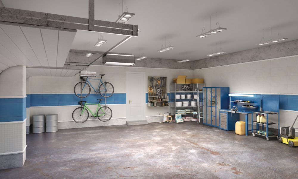 Spacious garage with bikes, tools, storage cabinets, and concrete floor. White and blue accents..— Ezyshelf in Rockhampton, QLD