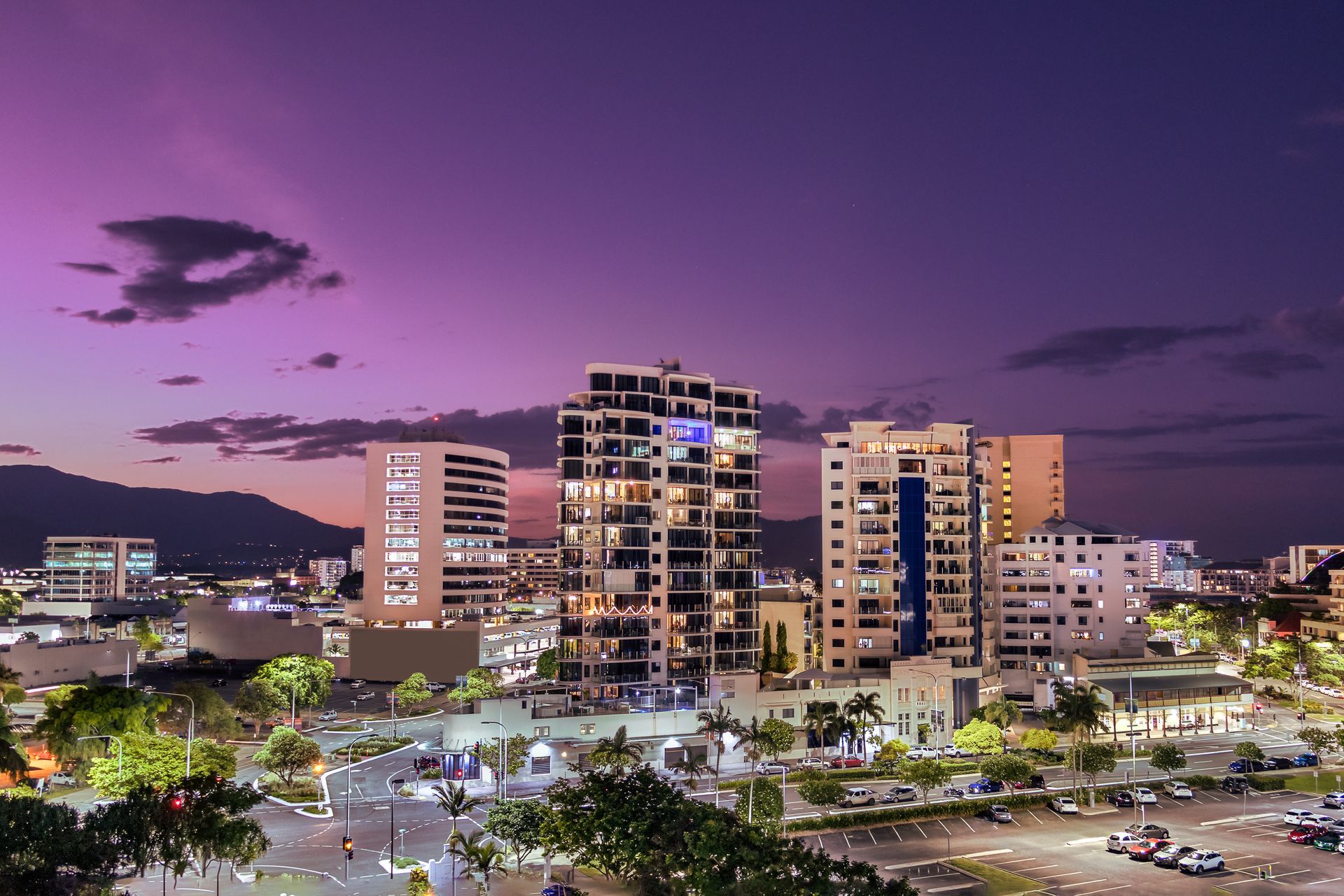 City Skyline at Dusk With Purple Sky and Illuminated Buildings — Ezyshelf in Cairns, QLD 
