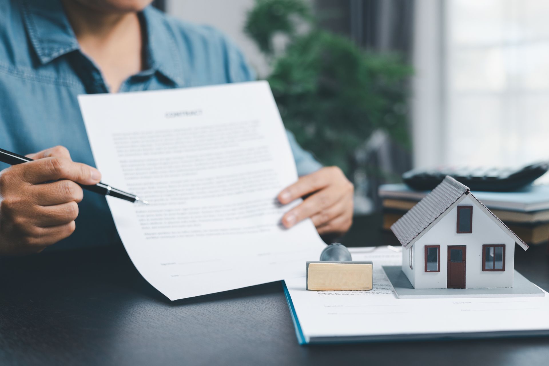 an elderly couple listening and sitting at a table