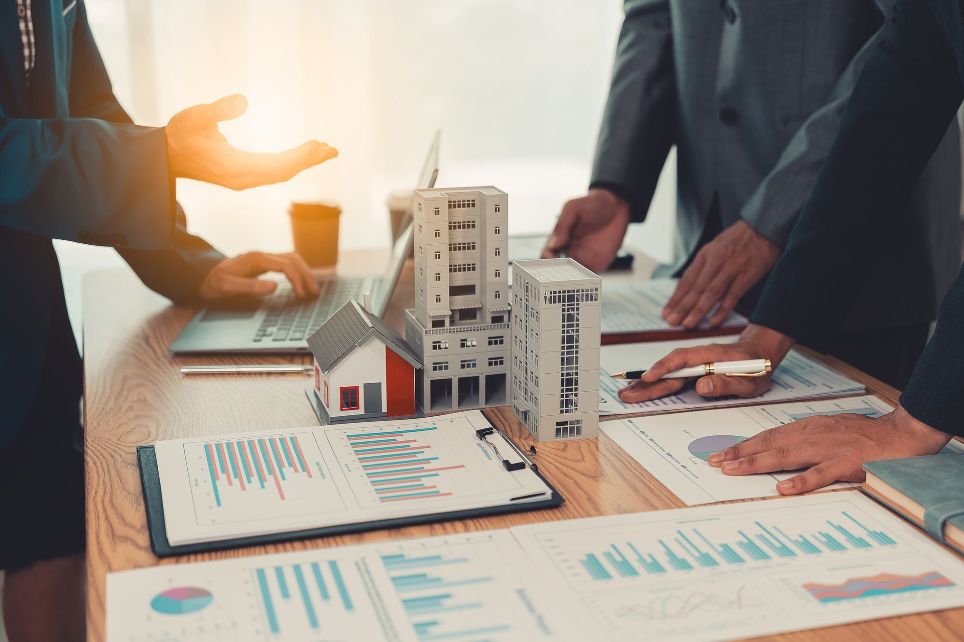 an elderly couple listening and sitting at a table