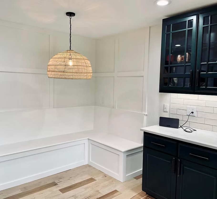 A row of apartment buildings with lots of windows against a blue sky.