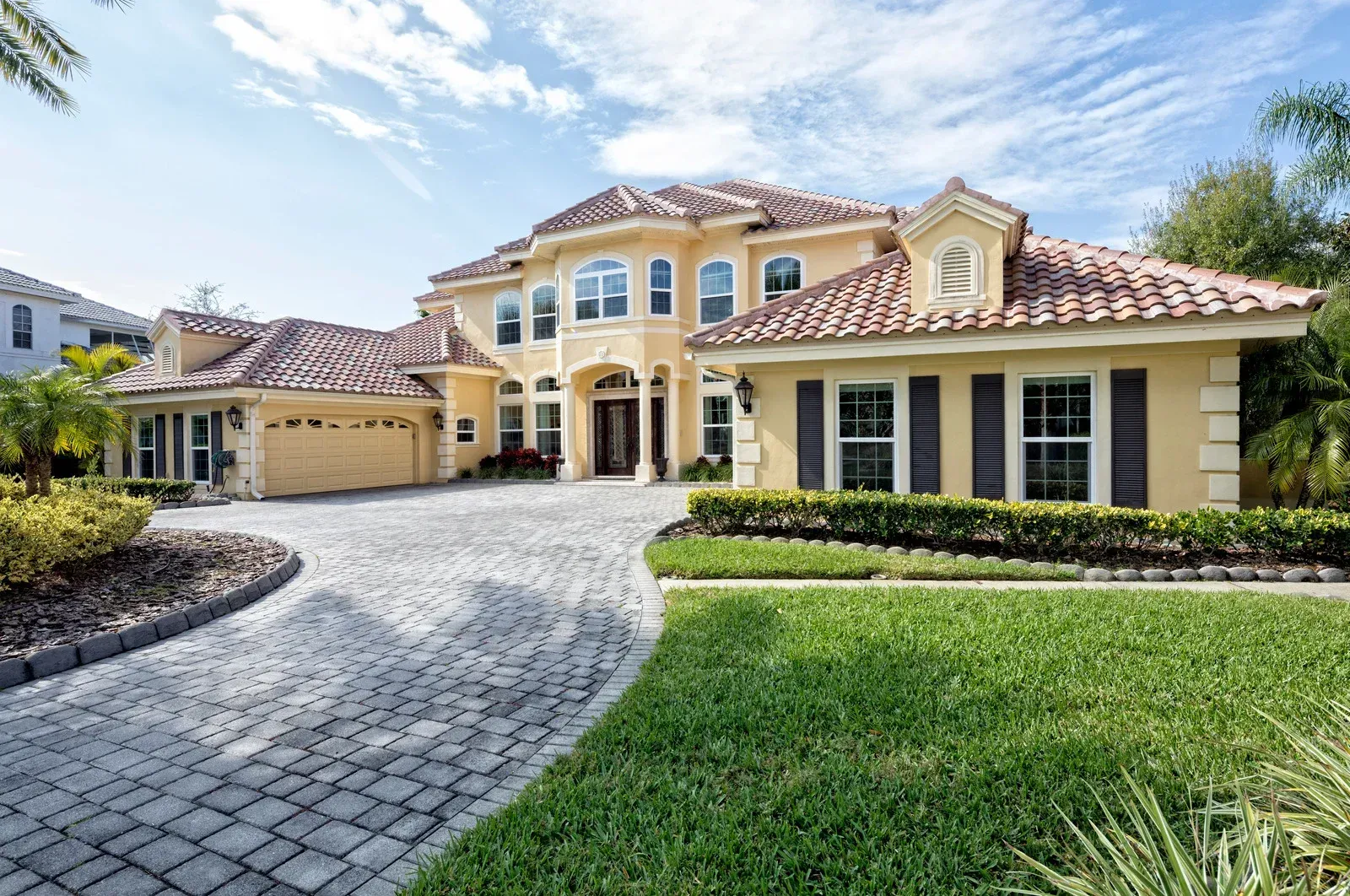 A large house with a driveway leading to it