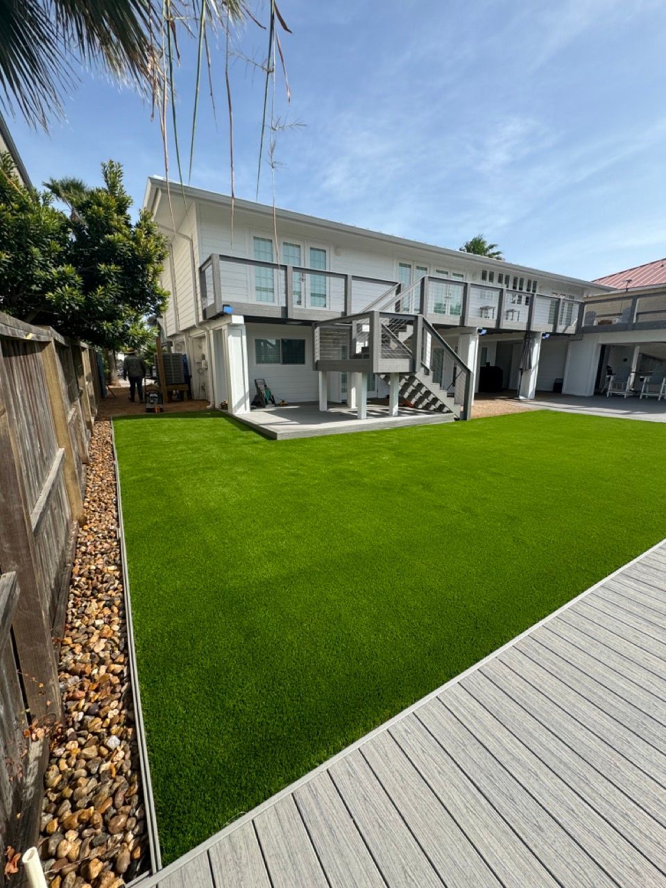 A large house with a large lawn in front of it.