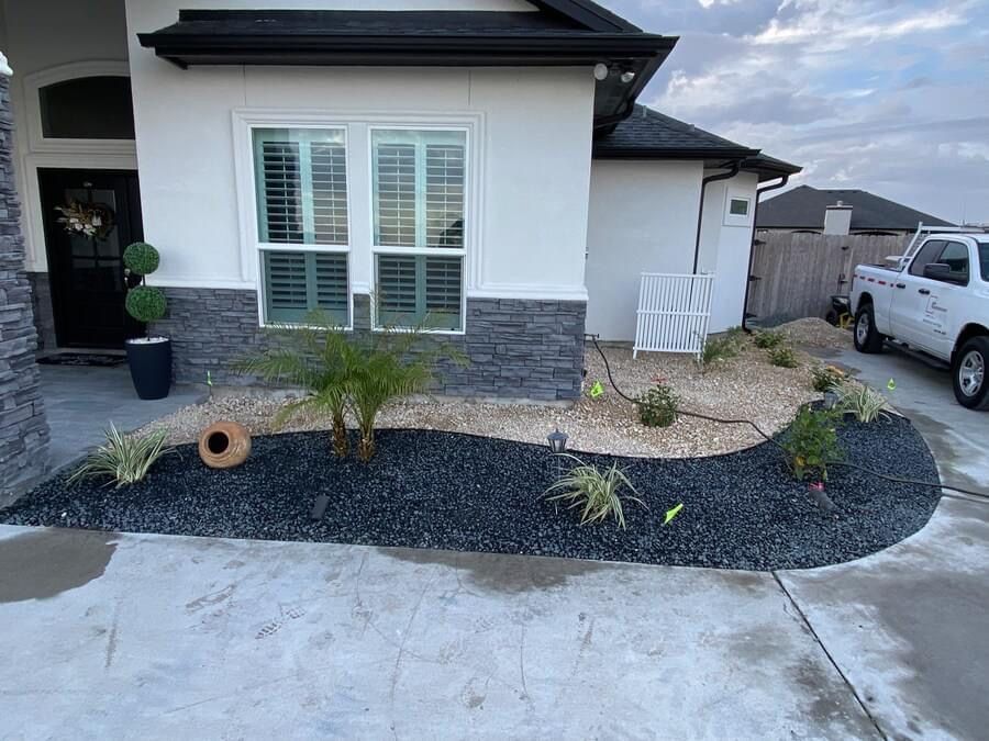A white house with a white truck parked in front of it.