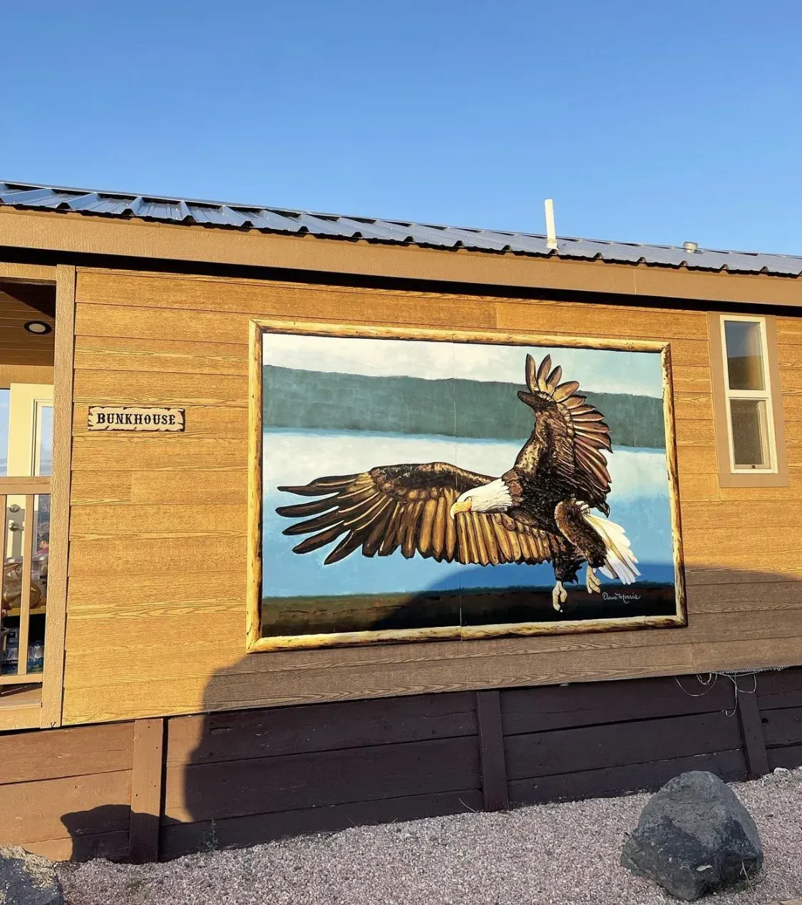 A painting of an eagle on the side of a house