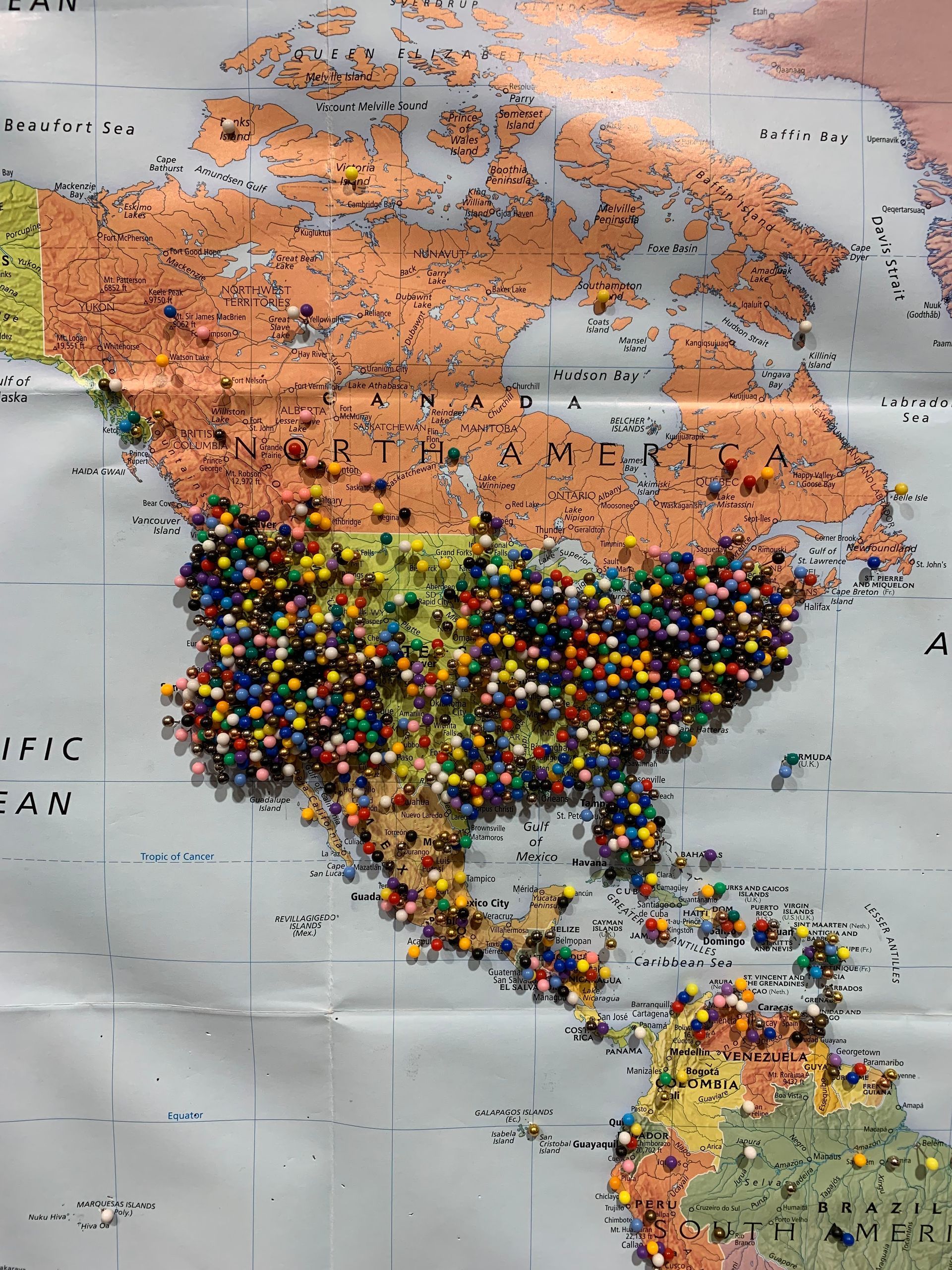 A map of the united states is covered in pins