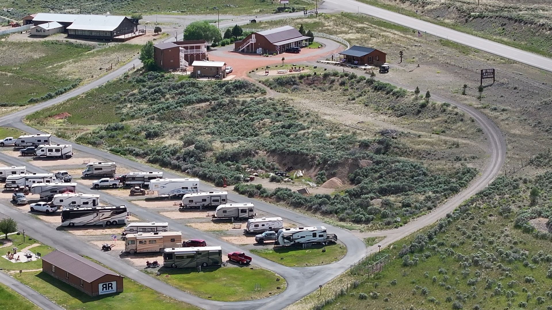 An aerial view of a campground with a lot of rv 's parked