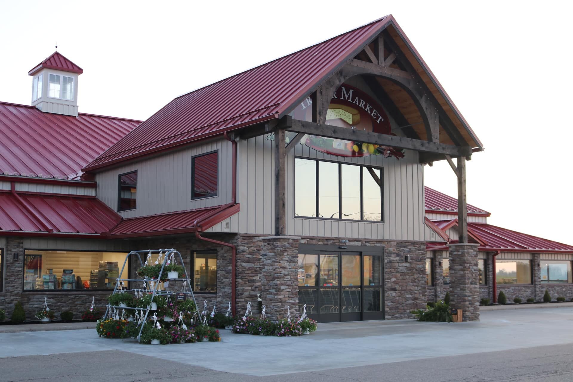 A large building with a red roof and the word market on it