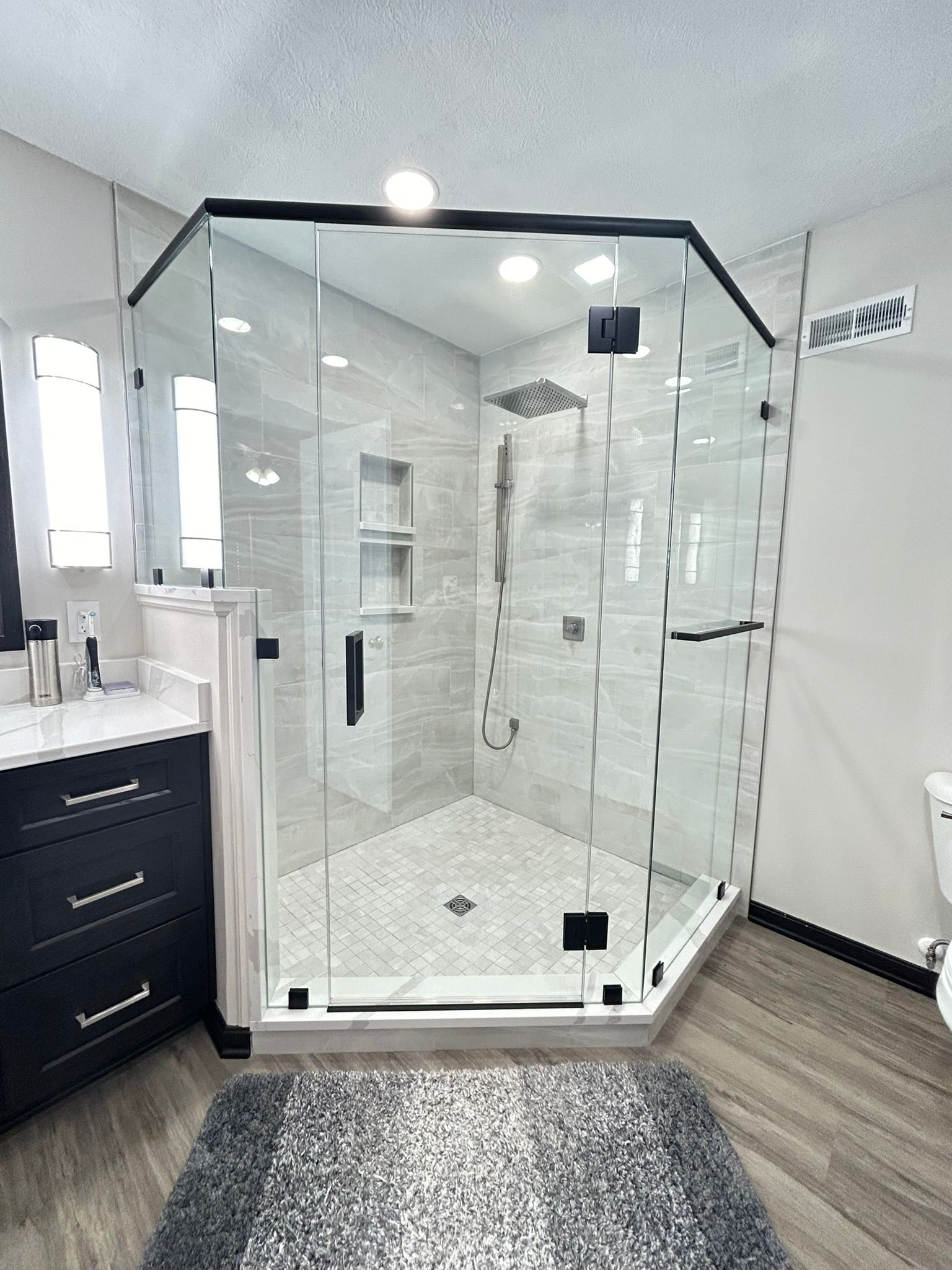A bathroom with a bathtub and a walk in shower.