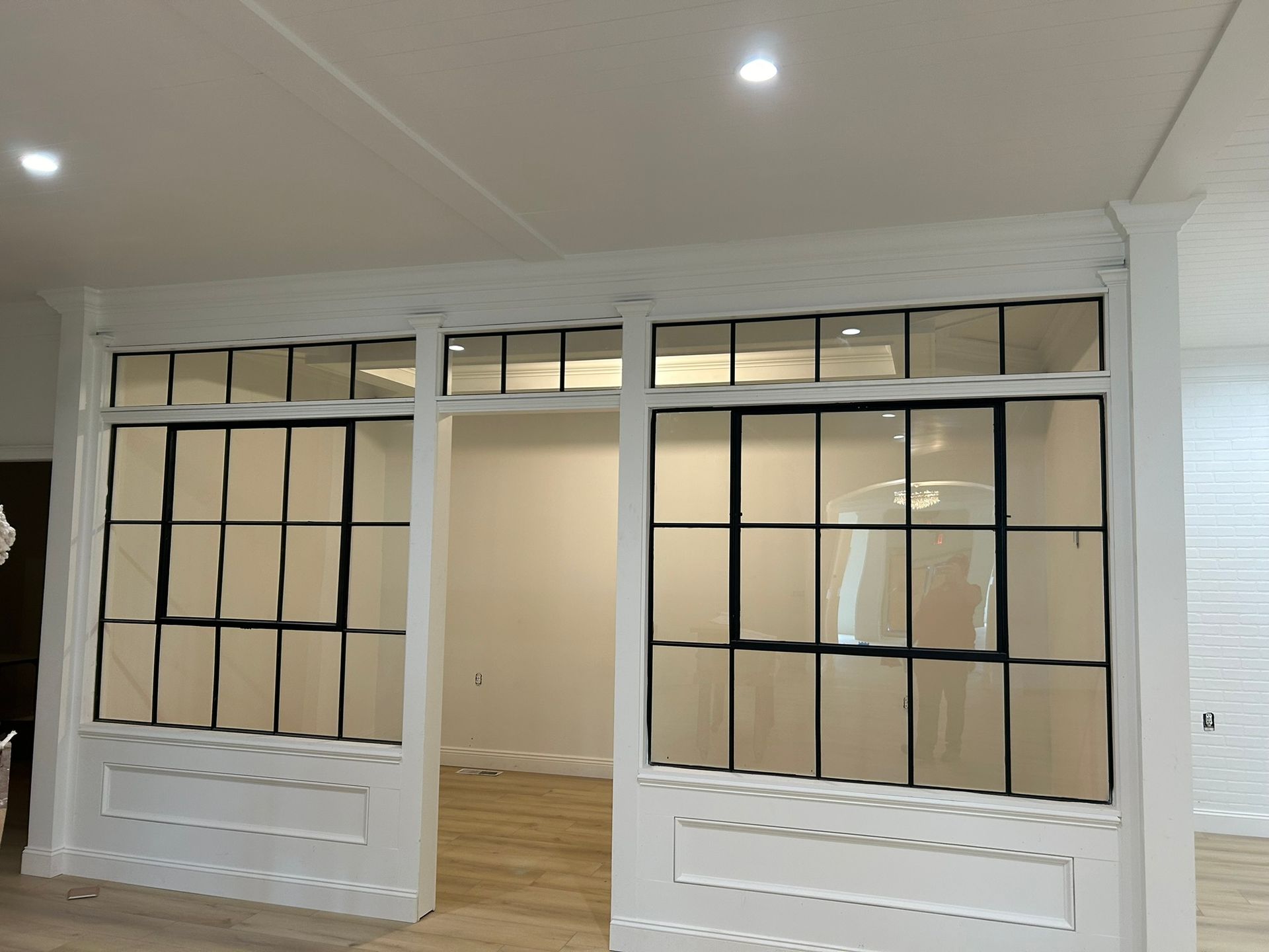 A room with a lot of windows and a door