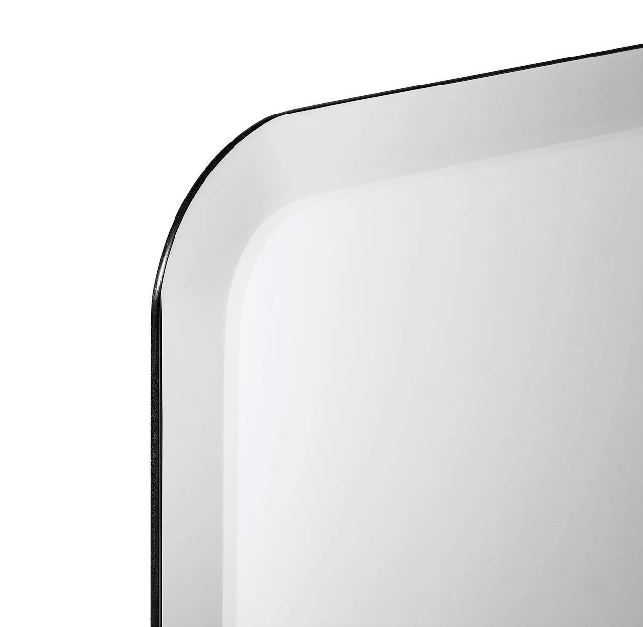A close up of a mirror with a curved edge on a white background.