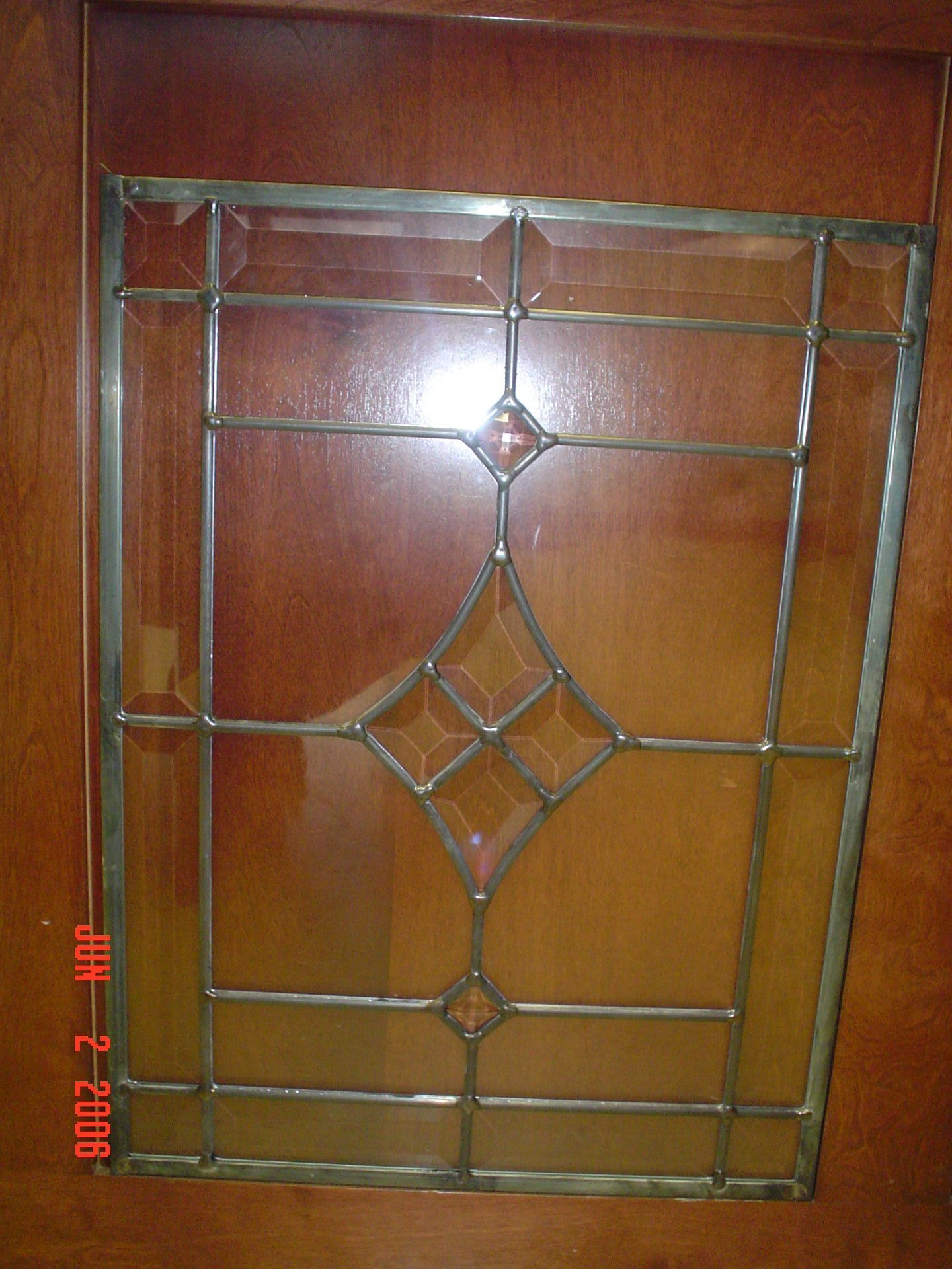 A picture of a stained glass window was taken on february 2 2006