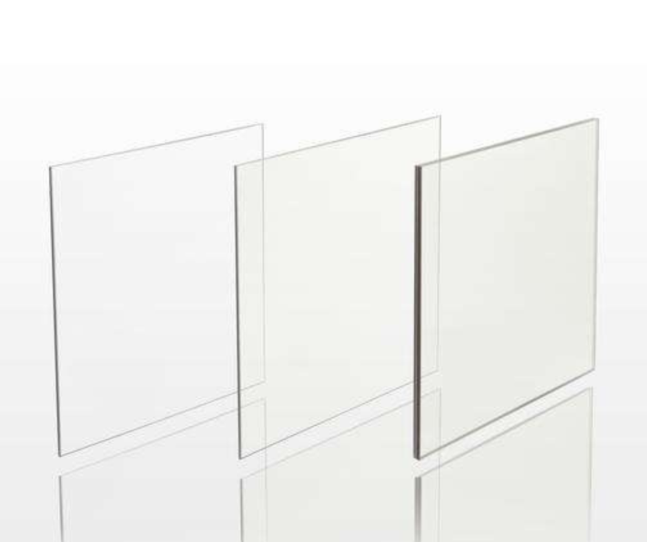 Three clear acrylic sheets are stacked on top of each other on a white surface.