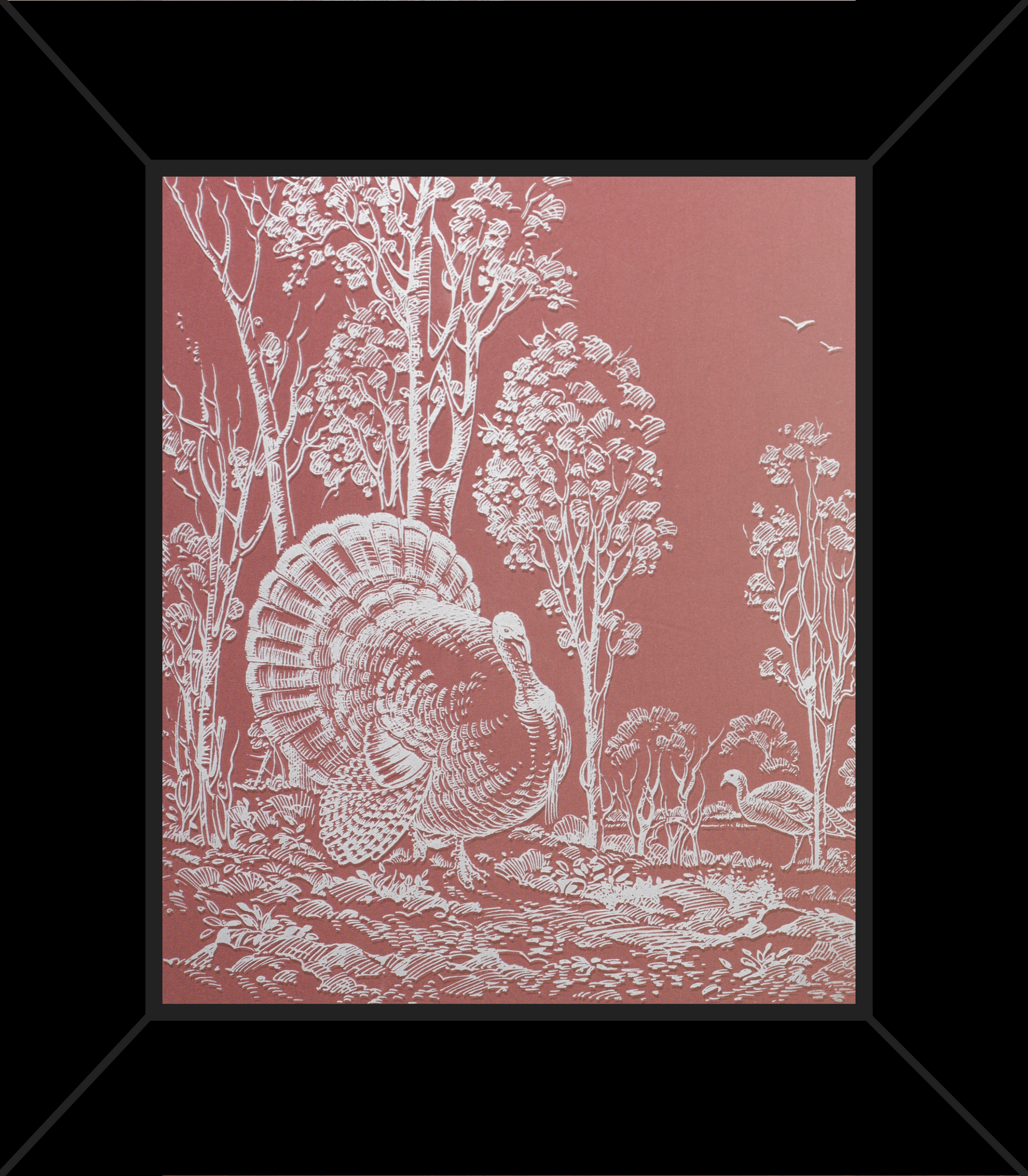 A framed picture of a turkey in a forest
