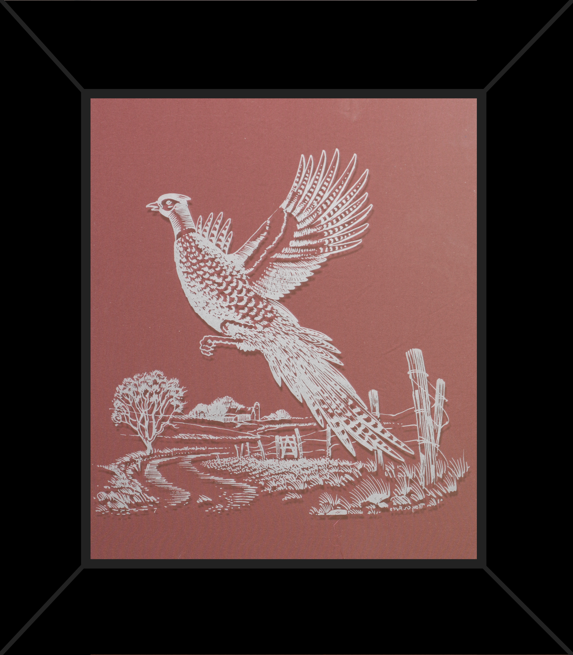 A framed picture of a pheasant flying over a fence