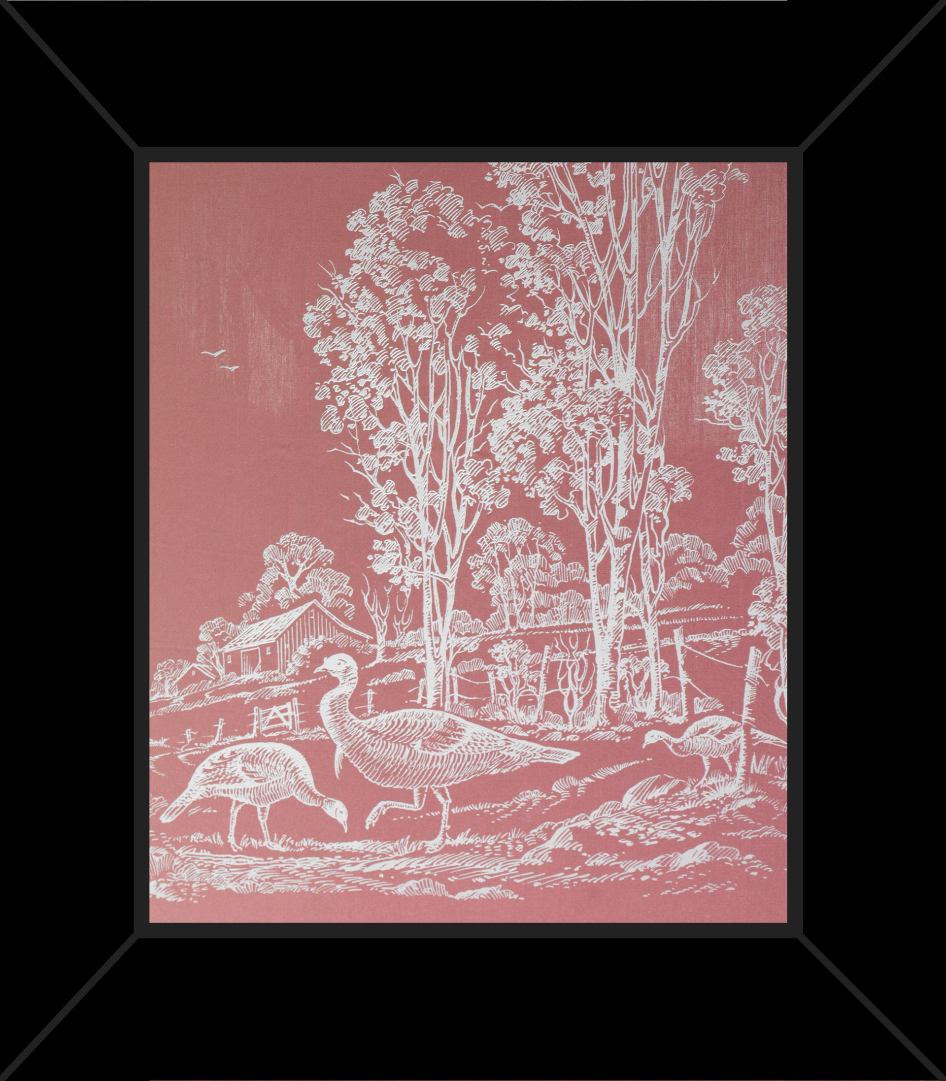 A framed picture of trees and sheep on a red background