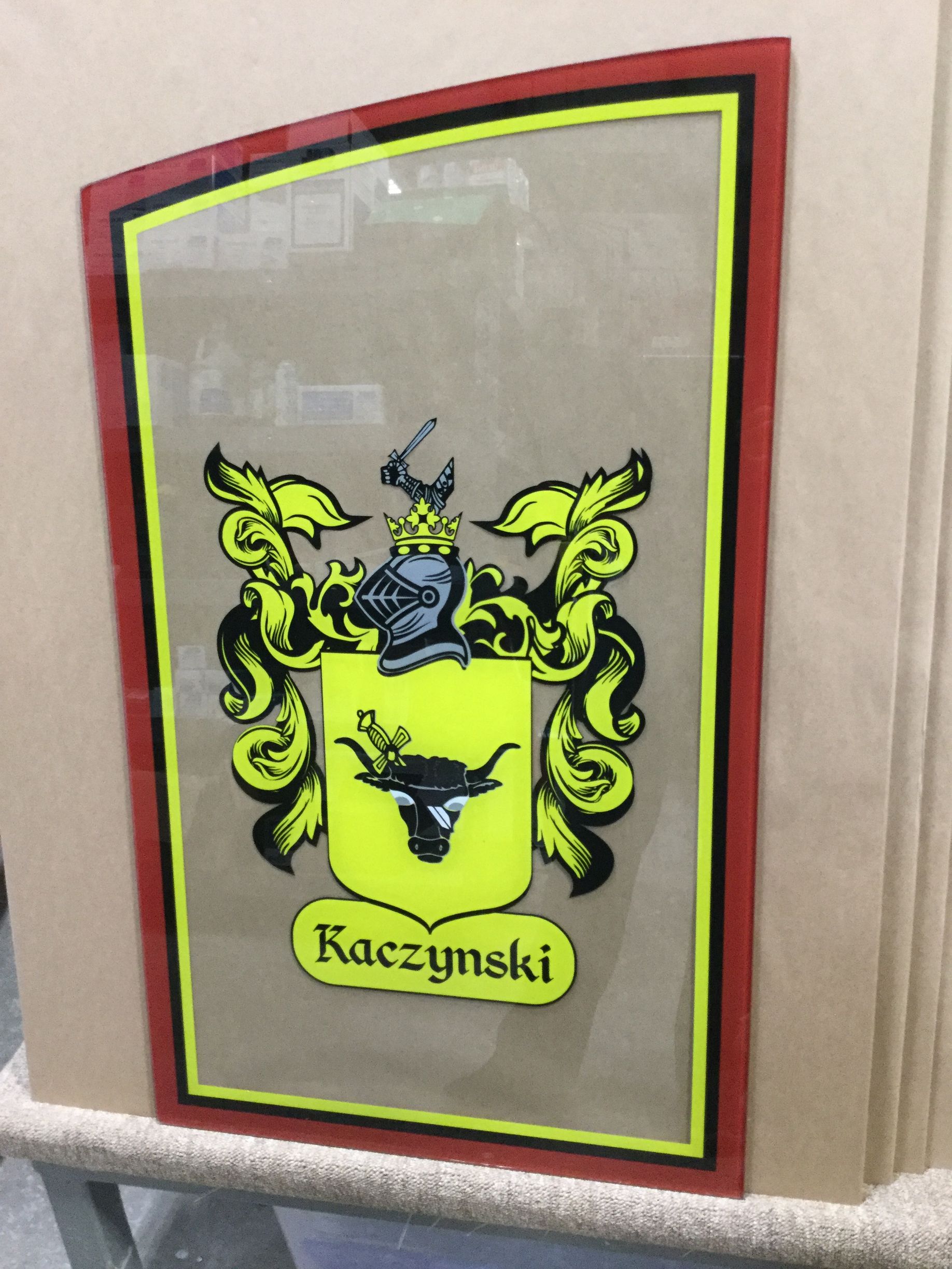 A picture of a coat of arms with the name kaczynski on it