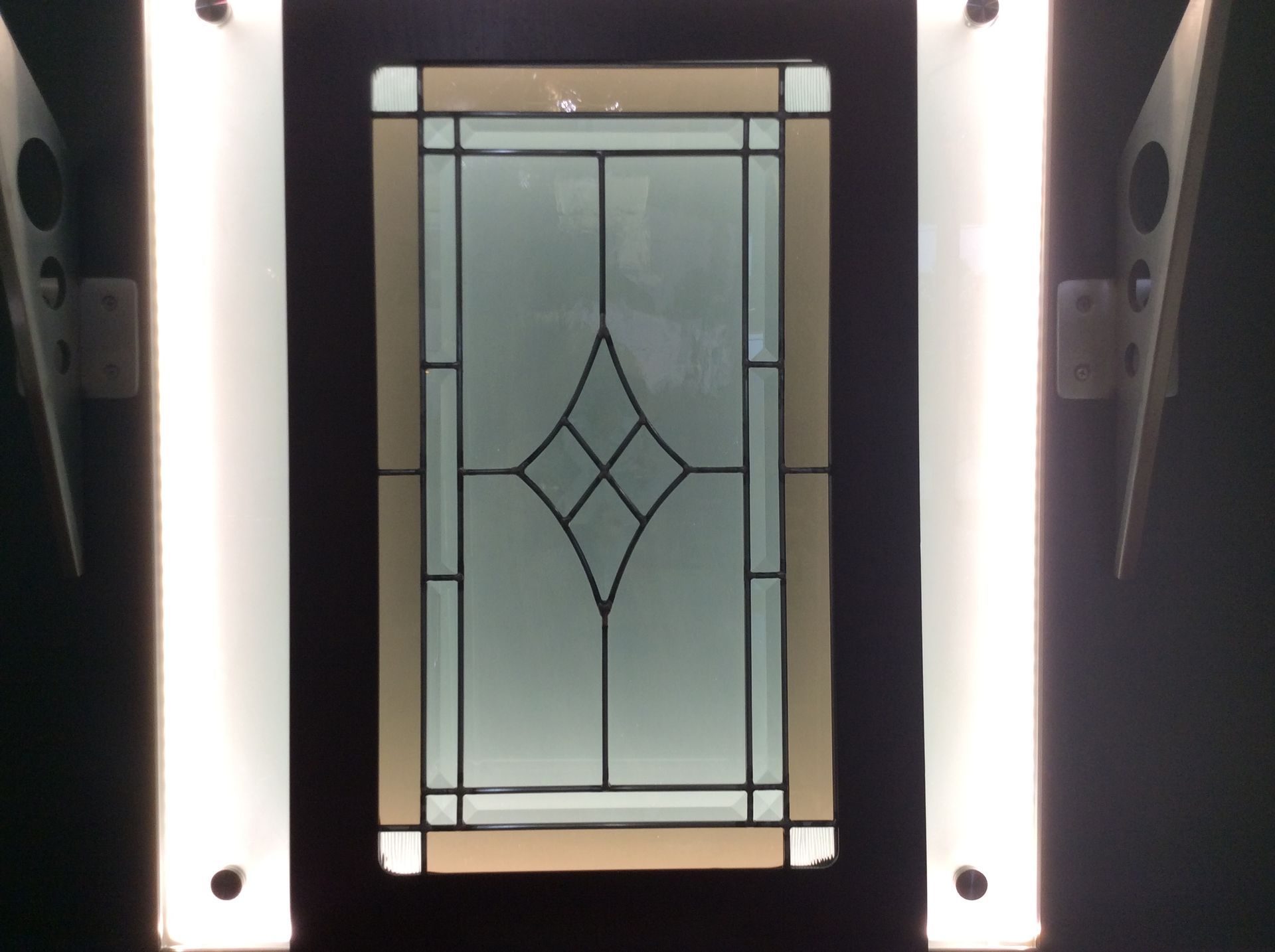 A stained glass window with a diamond design on it