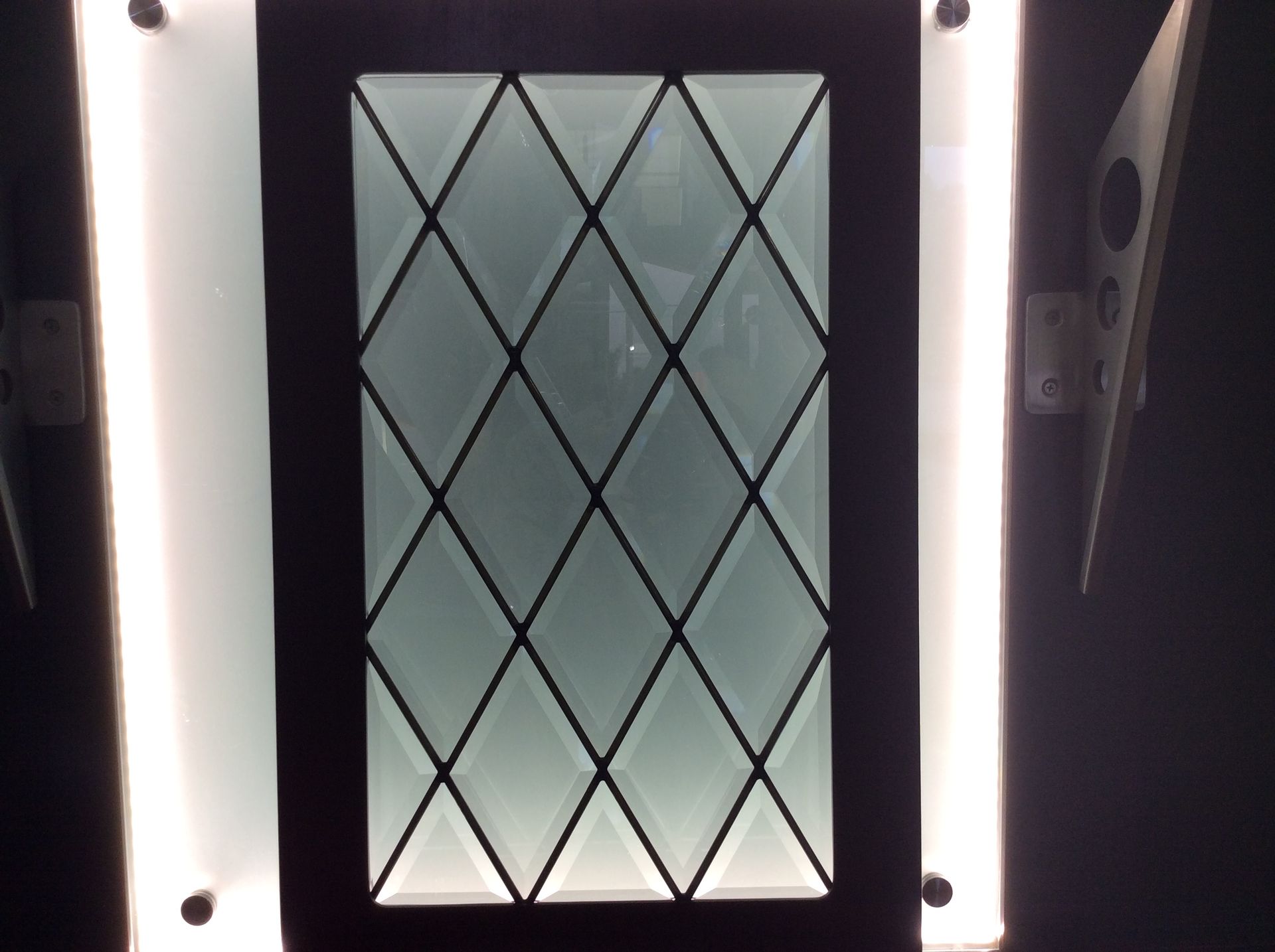A stained glass window with a diamond pattern on it