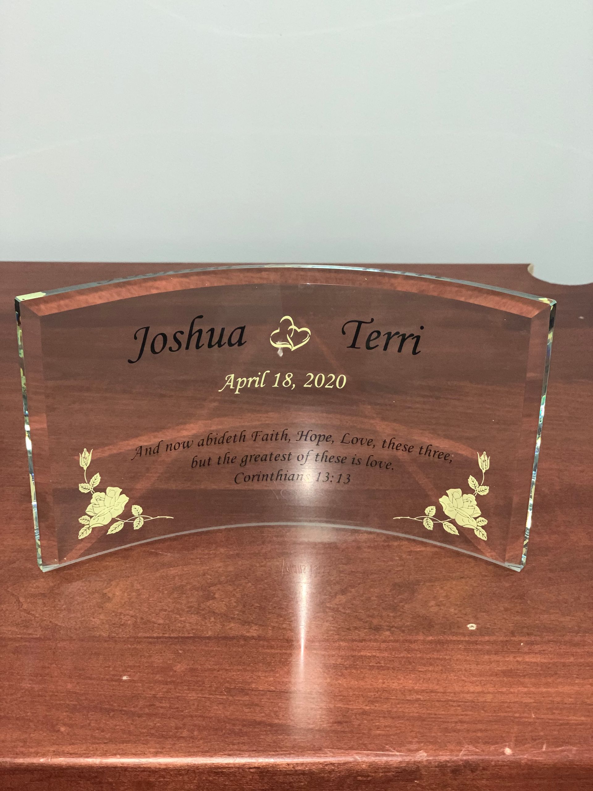 A glass plaque with the names joshua and teri on it