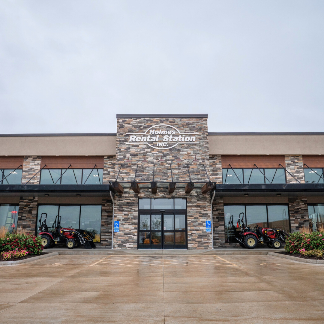 A large building with a sign that says rental station