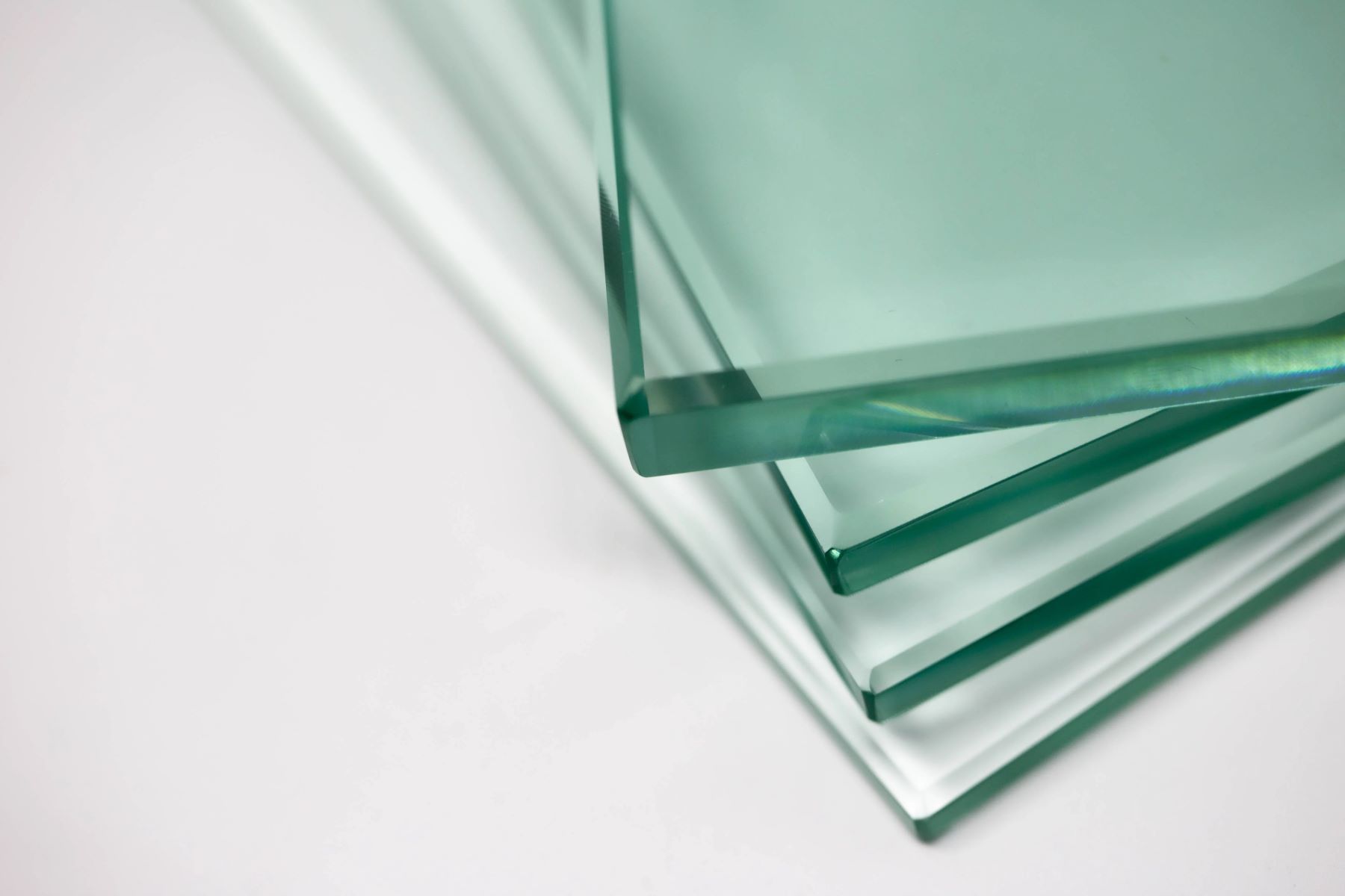 Three pieces of glass are stacked on top of each other