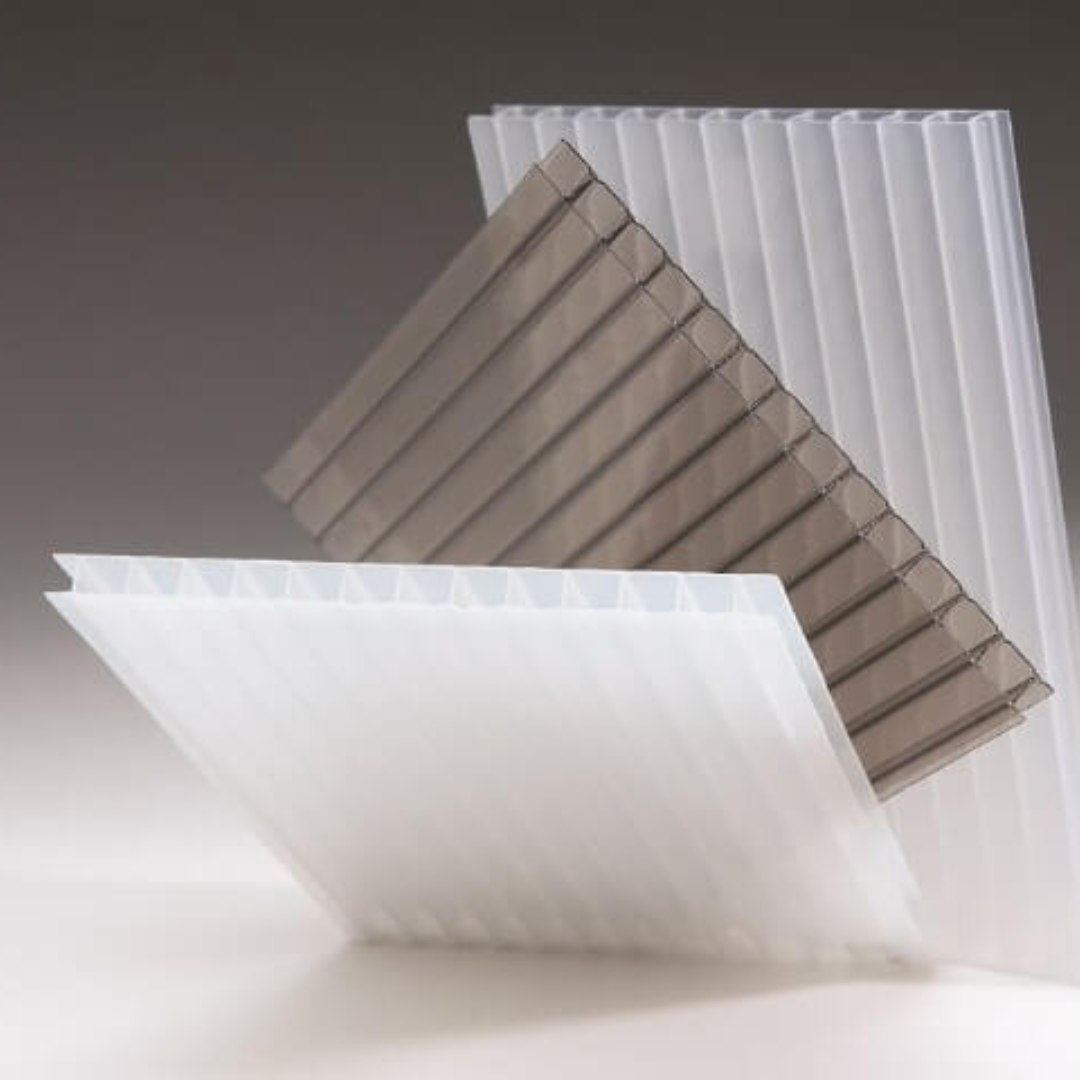 A stack of clear and brown plastic sheets on a table