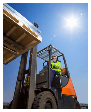 A man in a forklift truck lifting some wooden pallets