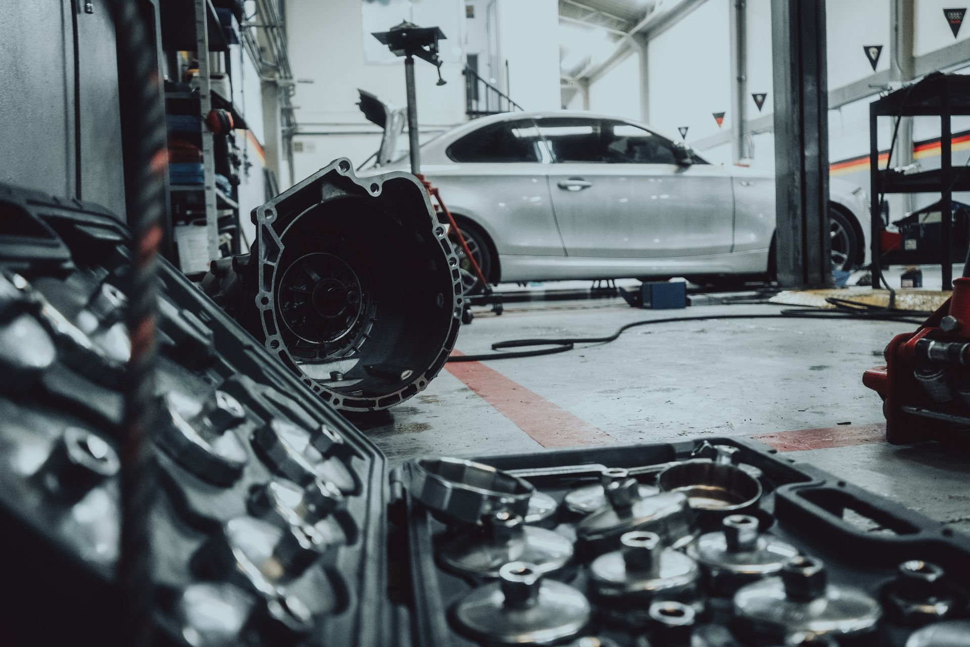 A car is being worked on in a garage.