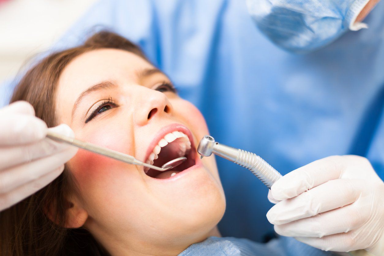 woman getting fillings at the dentist