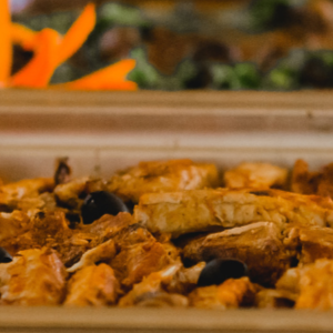 A group of people sitting around a conference table in an office, discussing a digital presentation.