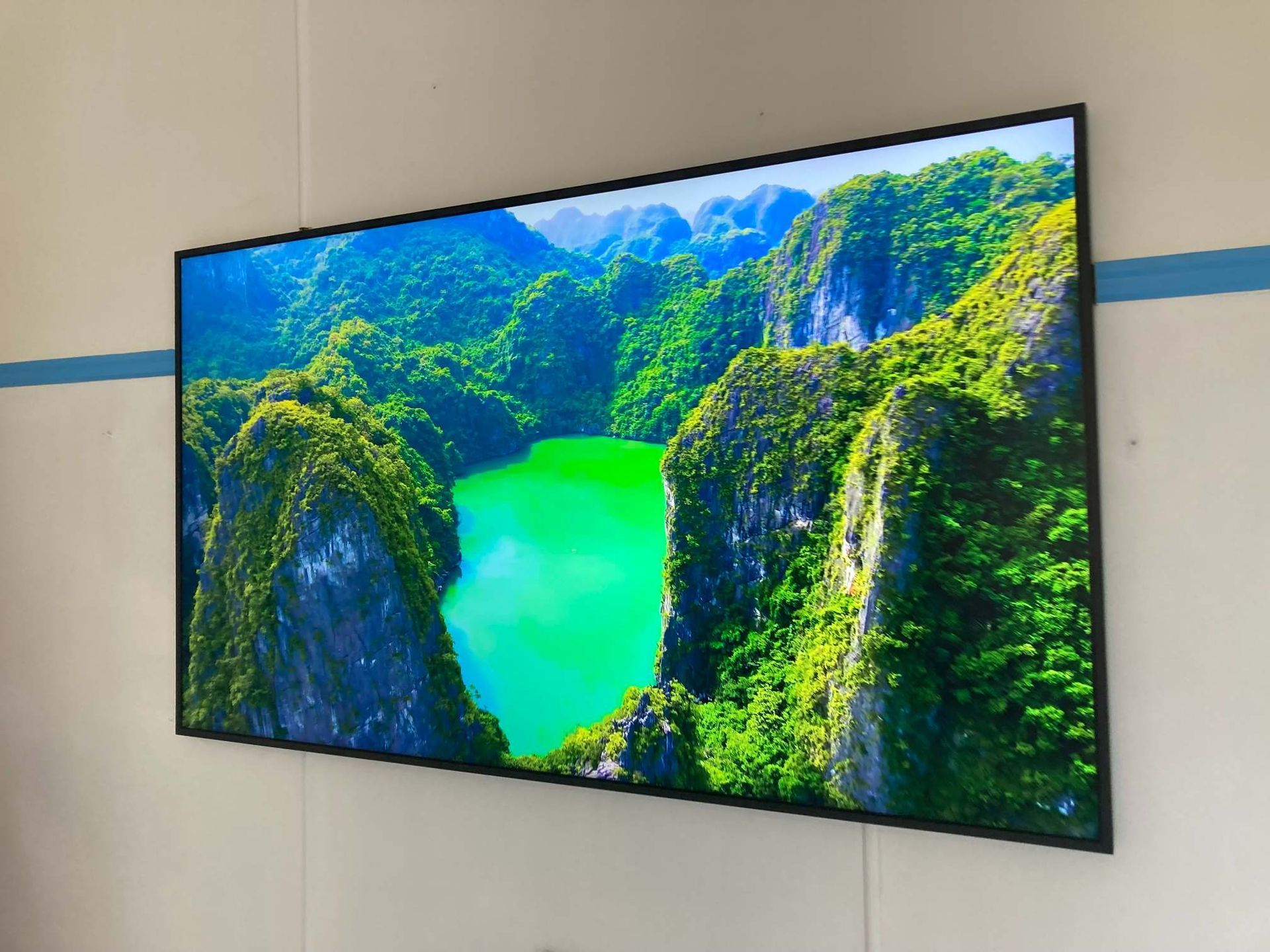 Large Flat-screen TV on a Wall Displaying a Vibrant Landscape — BRC Antenna Service 1 In Banora Point, NSW