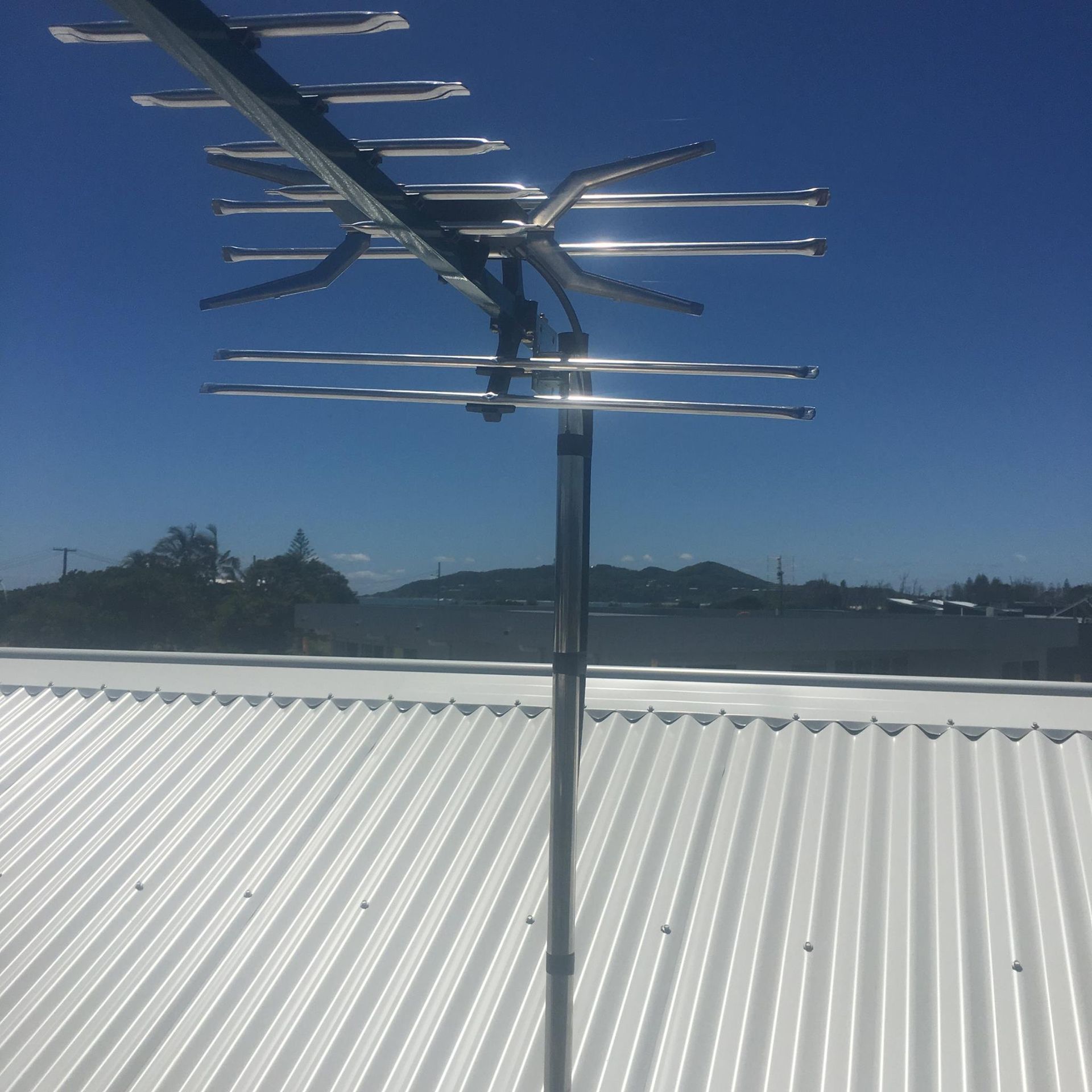 A Silver Antenna on a White Corrugated Roof — BRC Antenna Service 1 In Banora Point, NSW