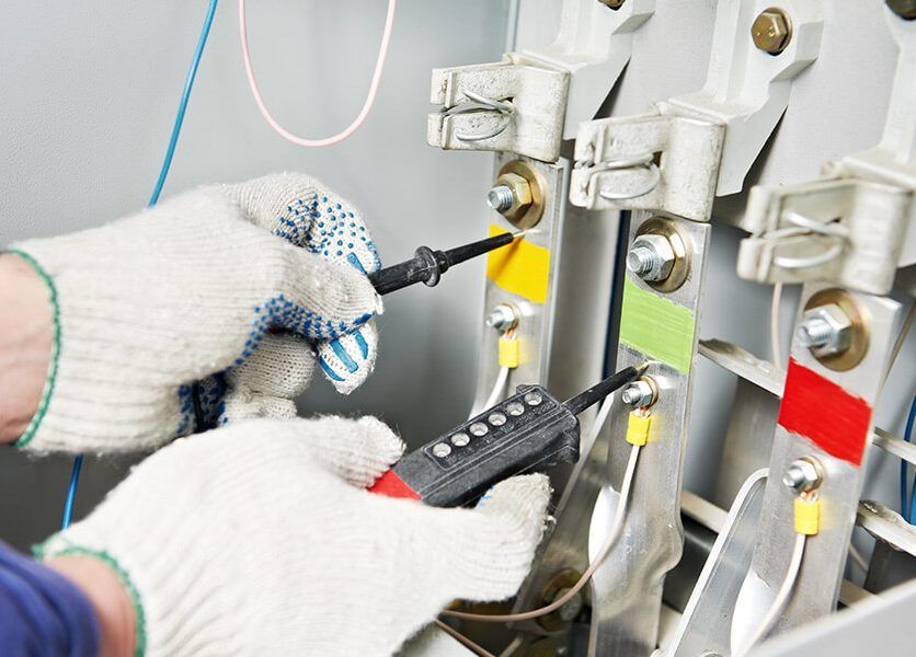 Checking electrical with gloves