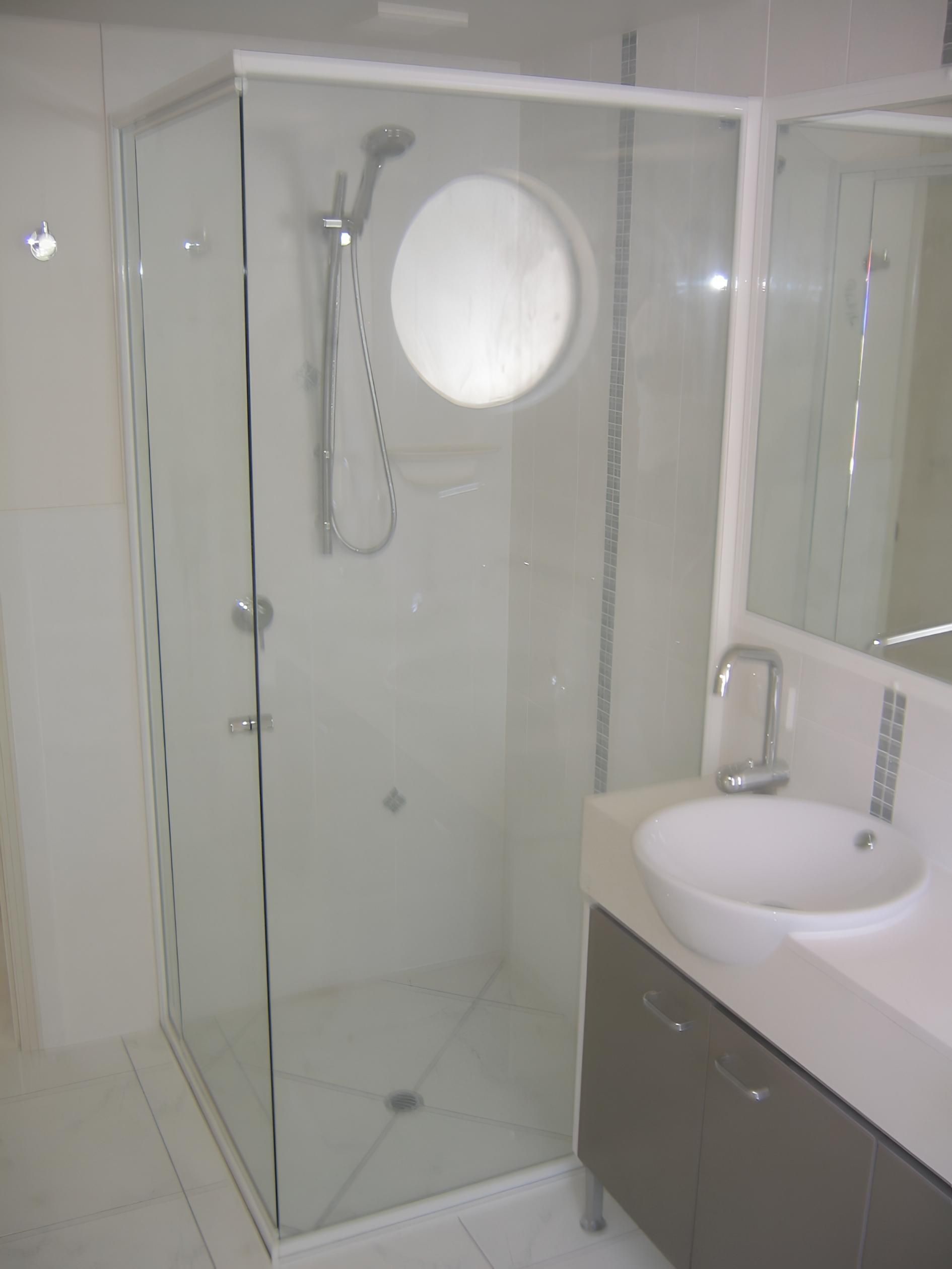 Modern Bathroom With a Glass Shower Stall — Hervey Bay Glass Glazing & Screens In Maryborough, QLD