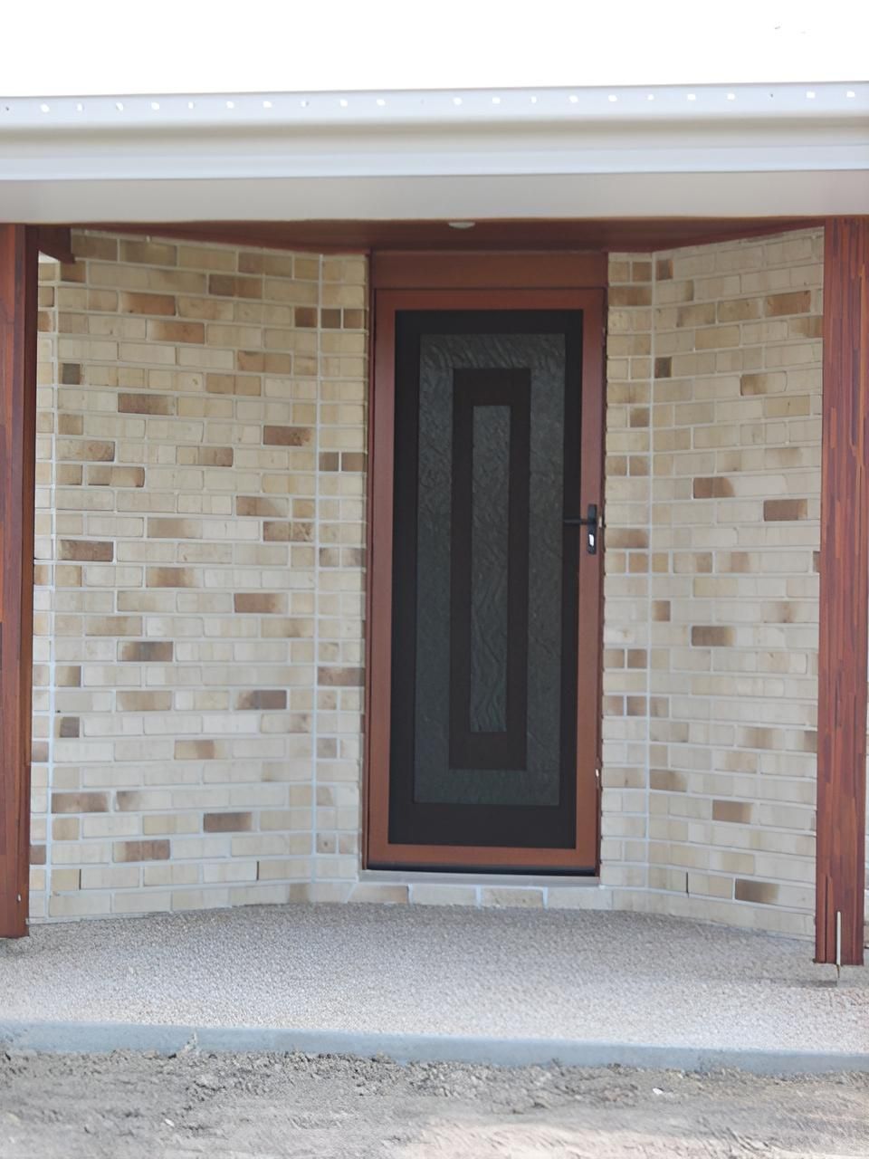 Brown-framed Security Door With Flyscreen— Hervey Bay Glass Glazing & Screens In Maryborough, QLD