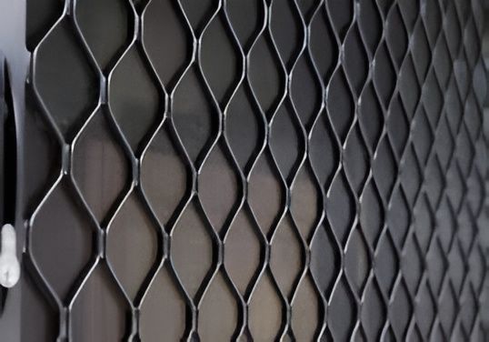 Close-up of a Dark Metal Flyscreen — Hervey Bay Glass Glazing & Screens In Pialba, QLD
