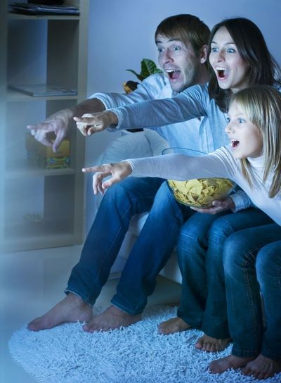 Family enjoy watching TV after digital TV installation in Auckland 