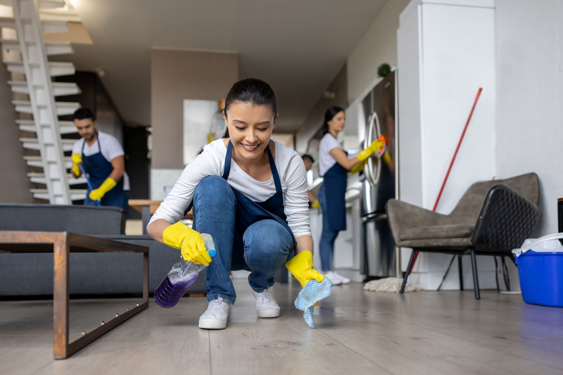 Happy professional cleaner cleaning a spot on the floor - Ottumwa, IA - Heaven's Best Ottumwa, IA